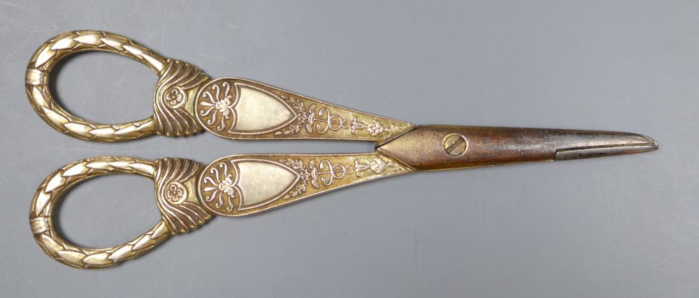 A late 19th century Russian engraved 84 zolotnik beaker, 63mm, a silver mounted glass match strike(a.f.) and a pr of scissors.